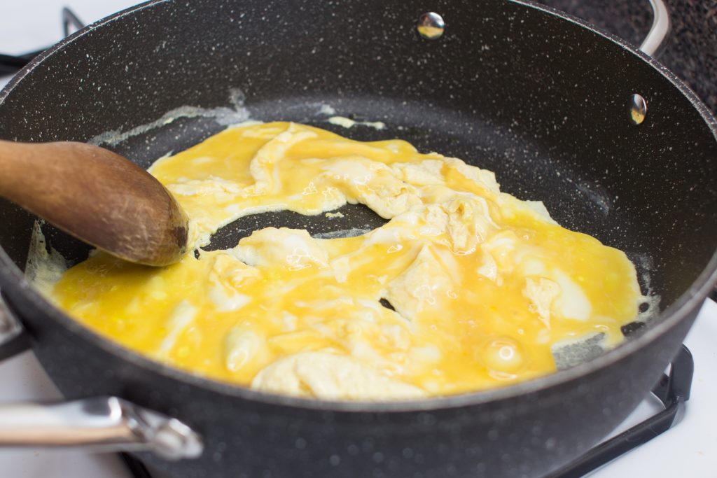 Eggs frying in pan